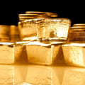 Is it better to invest in gold coins or gold bars?